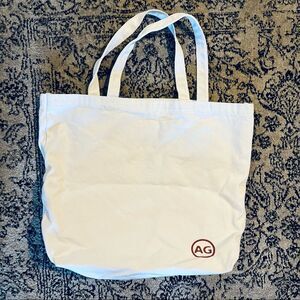 Adriano Goldschmied  AG White $ Red Double Handle Cloth Carry All Bag